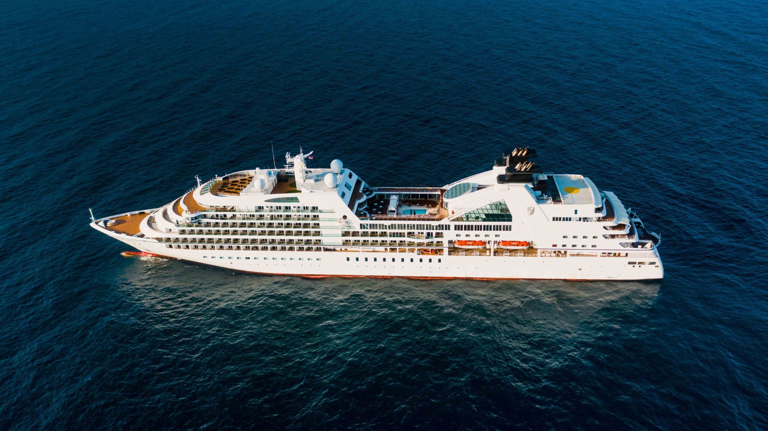 Cruise ship sailing in the ocean surrounded by water